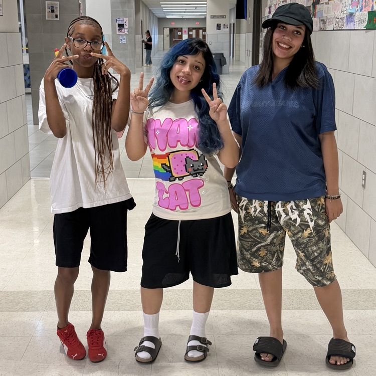 students posing for pictures 