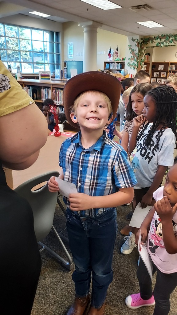 Young boy smiles for the camera.