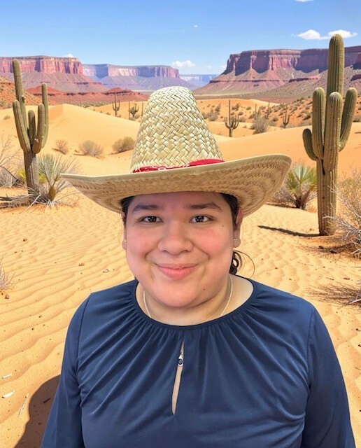 Student with western hat in front of a western scene