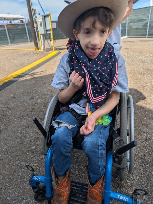 student in wheelchair with western wear