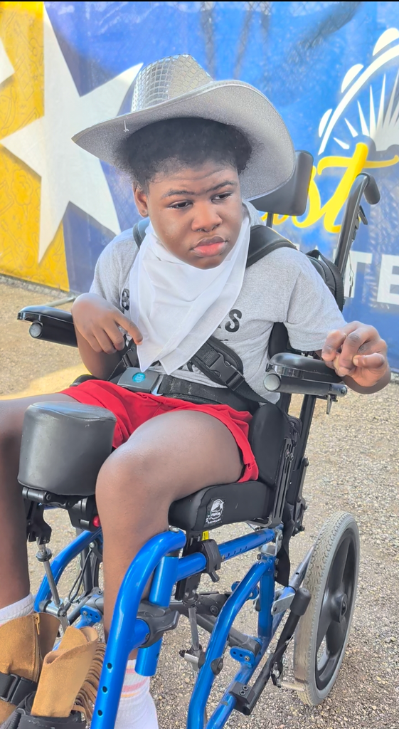 student in wheelchair with western wear