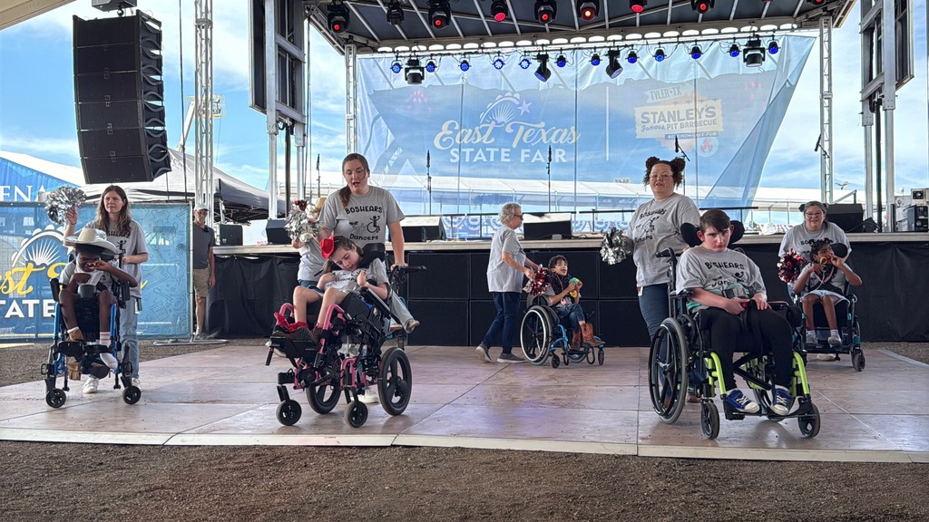 Wheelchair dance team performing on stage at the East Texas State fair