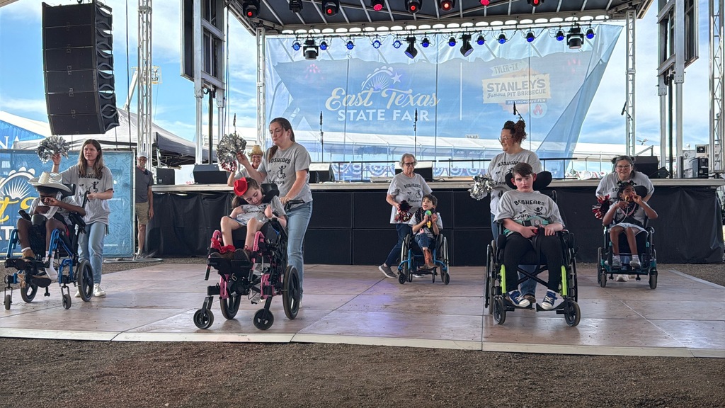 Wheelchair dance team performing on stage at the East Texas State fair