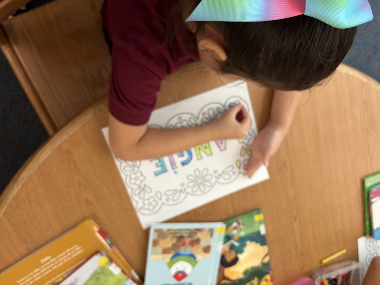 student coloring with paper