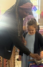 student exploring a bowl of ground cinnamon