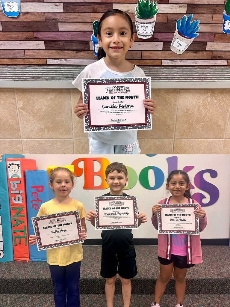 students holding certificates for leader of the month