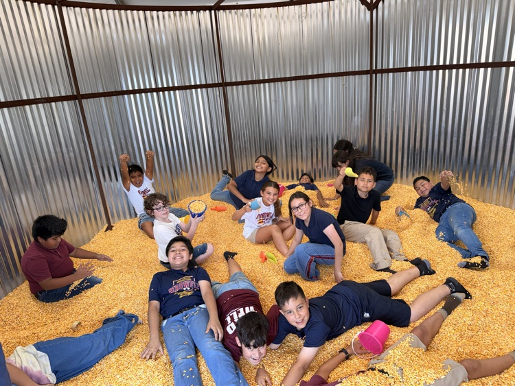 group of students in a corn mill