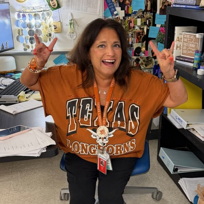 teacher in college shirt
