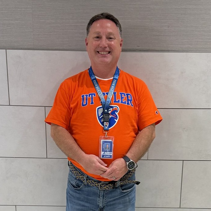 teacher in college shirt