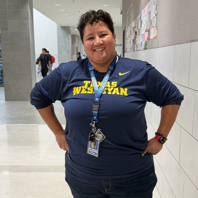 teacher in college shirt