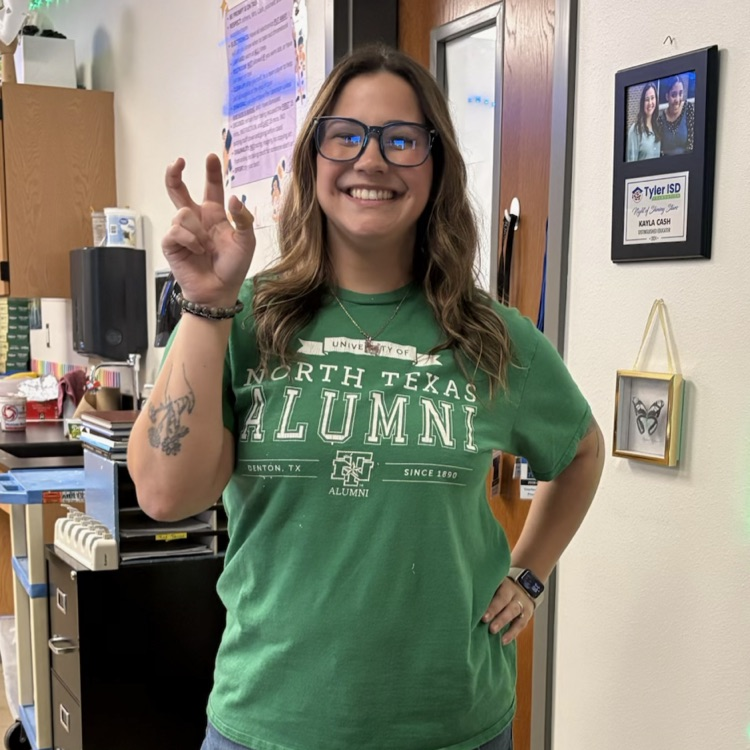 teacher in college shirt