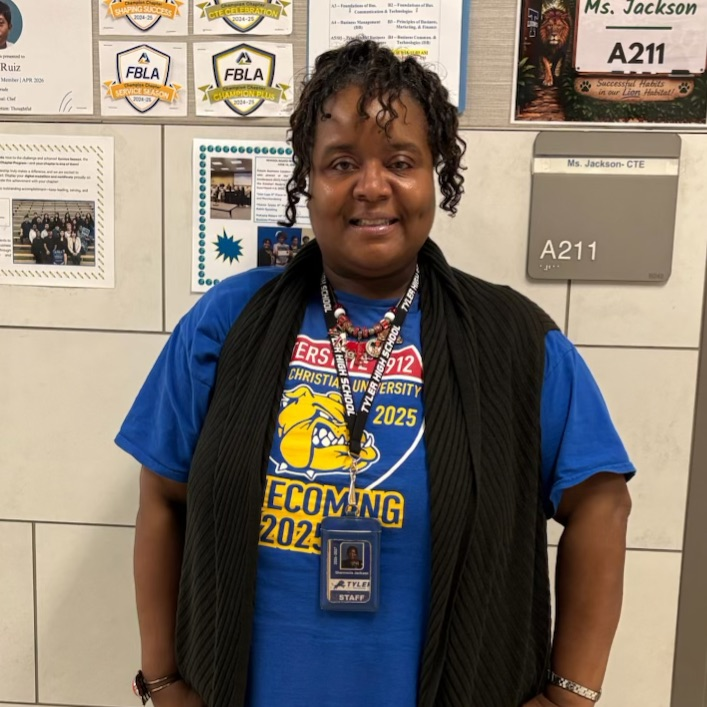 teacher in college shirt