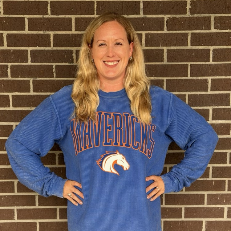teacher in college shirt