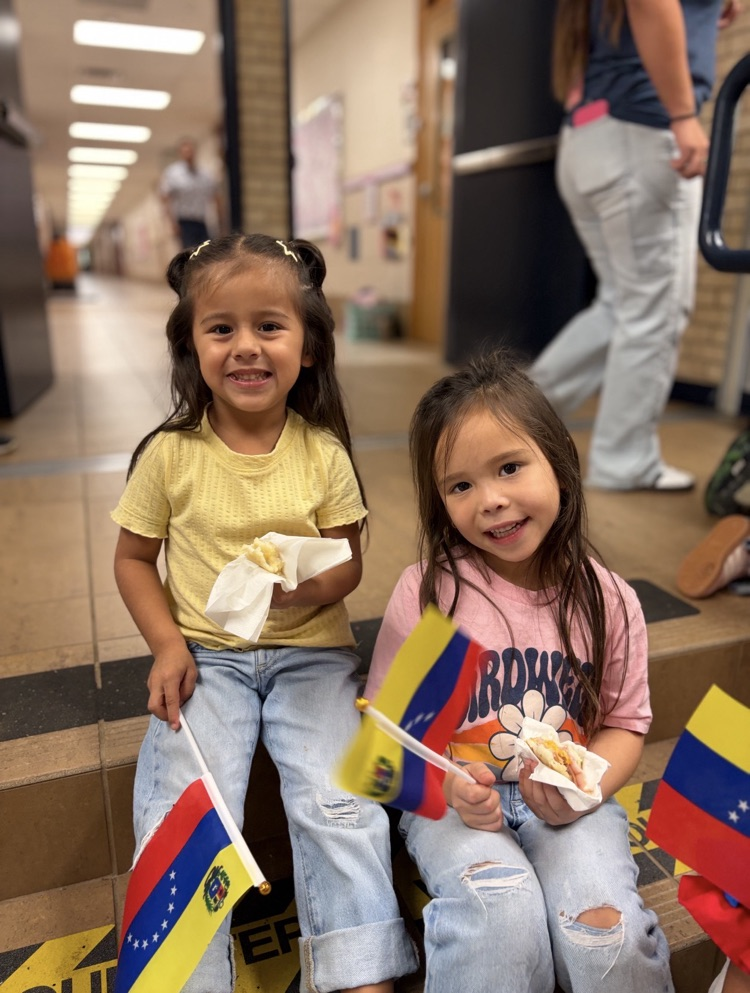 two girls holding flags