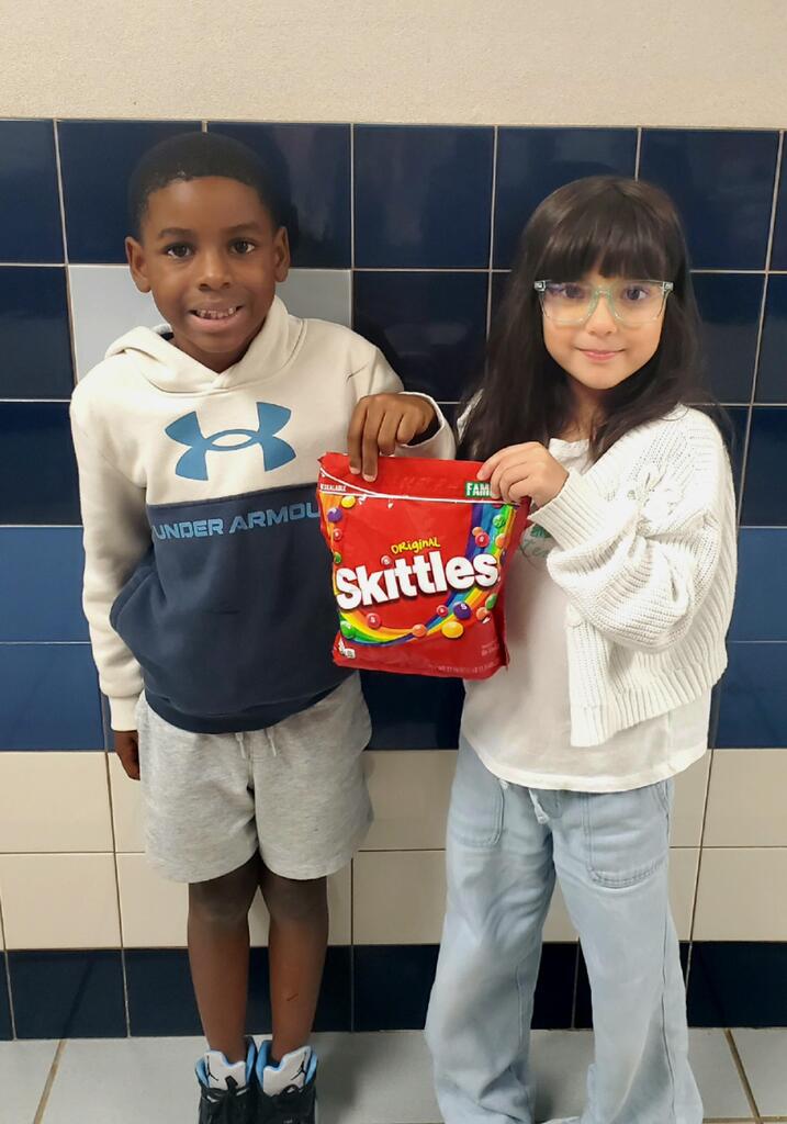 Kids holding Candy for the candy donation