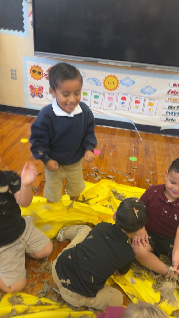 students playing in leaves