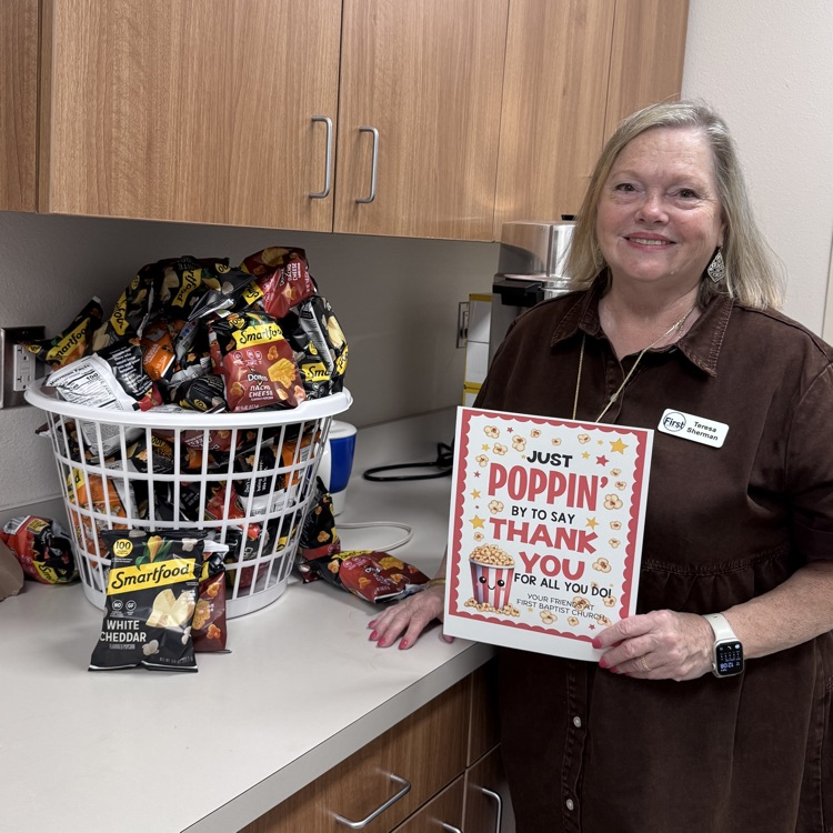 lady with a basket of Individual popcorn packages