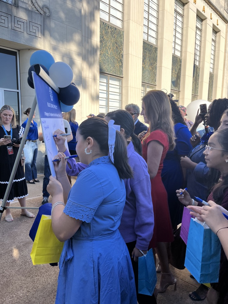 students watching outside at Blue Project event
