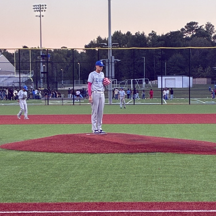pitcher on mound and player in outfield