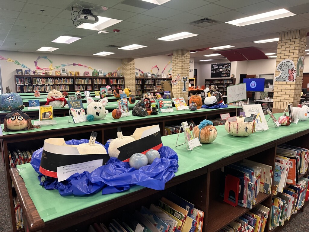 decorated pumpkins displayed in the library
