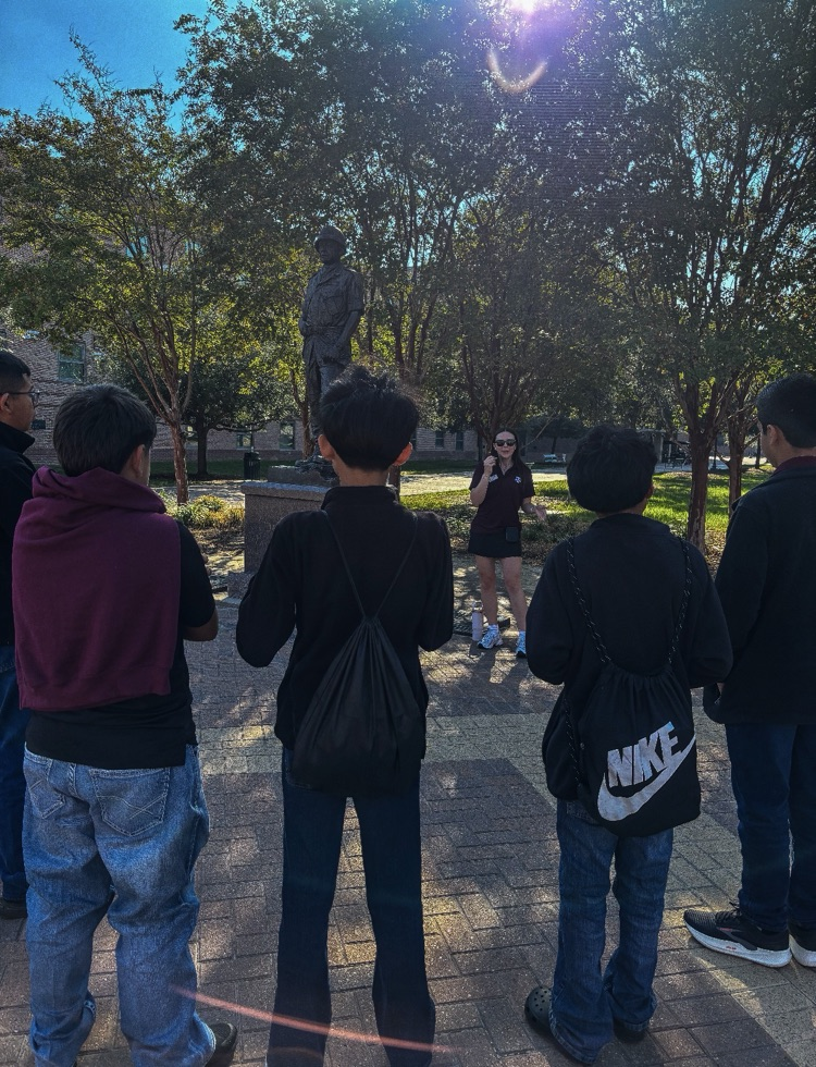 students on tour of A&M with backs turned