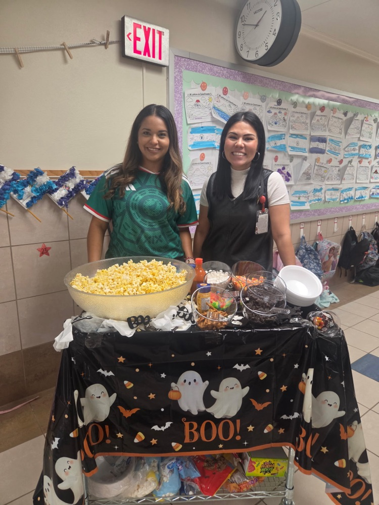 two women behind popcorn cart