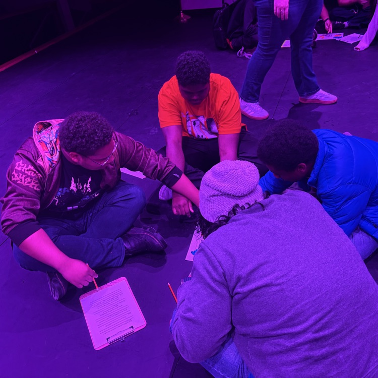 students sorting candy in blue light