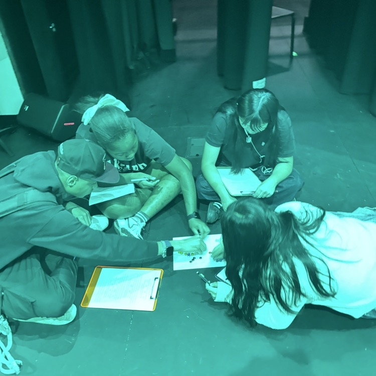 student sitting candy in green light