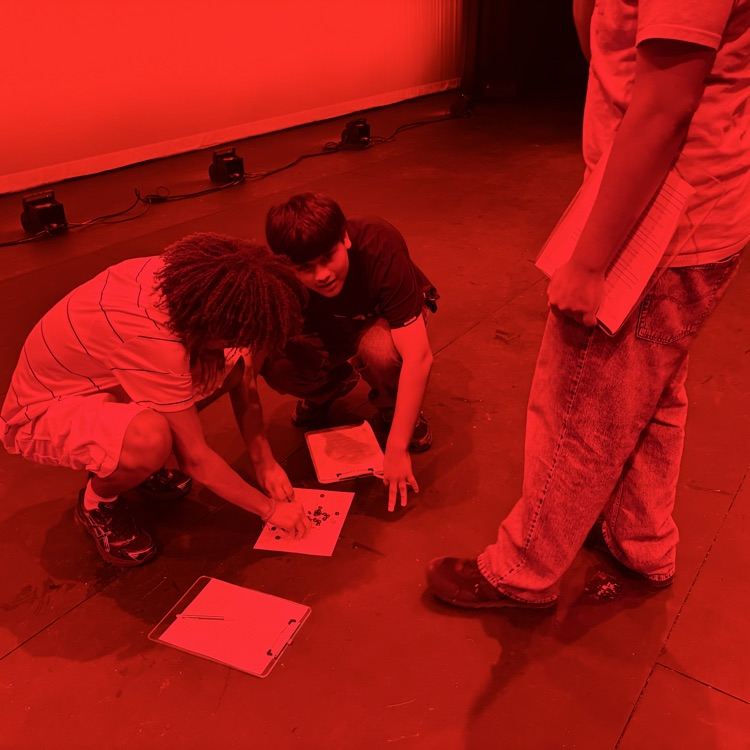 students sorting candy in red lights