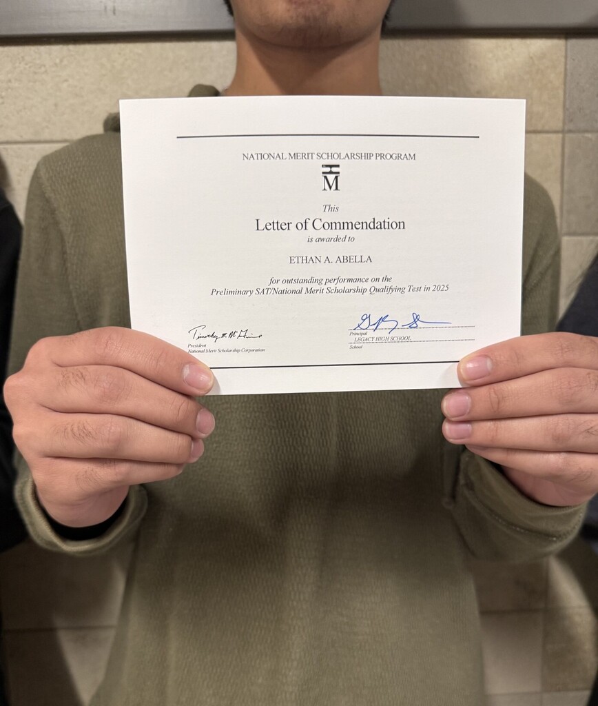 A person in a green long-sleeve shirt holds a certificate titled "Letter of Commendation" for Ethan Abilla.