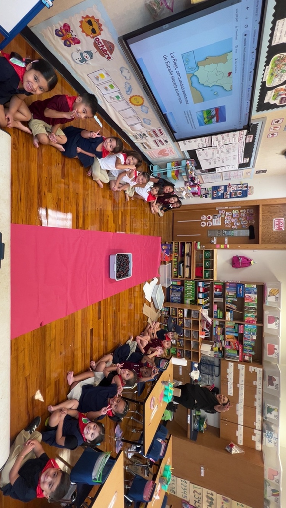 Full class picture of children wearing scarves