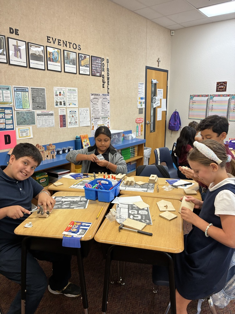 students at desk doing a science experiment