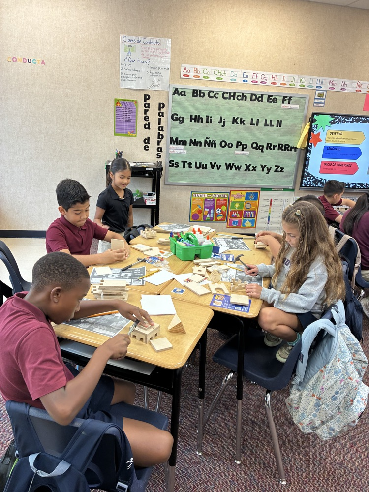 students using items to conduct a science experiment