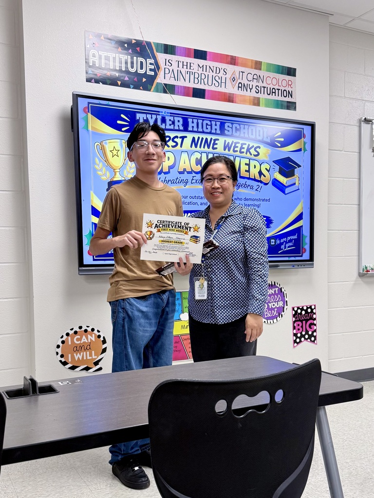 student and teacher with certificate