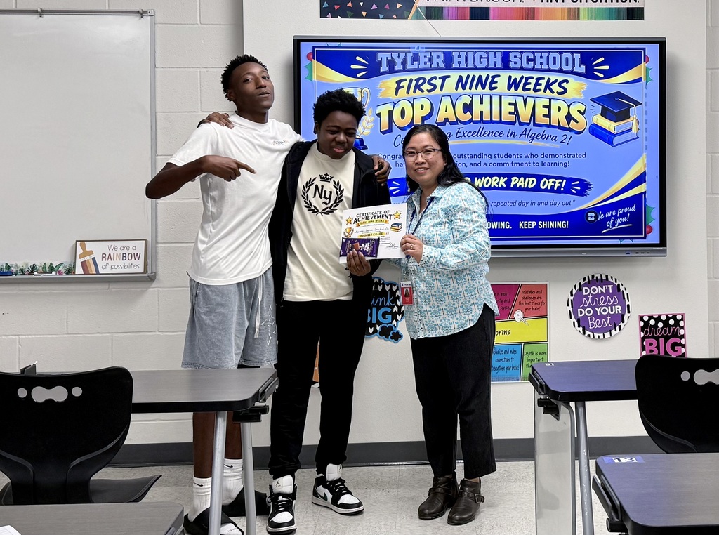 student and teacher with certificate