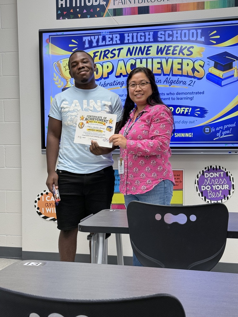 student and teacher with certificate