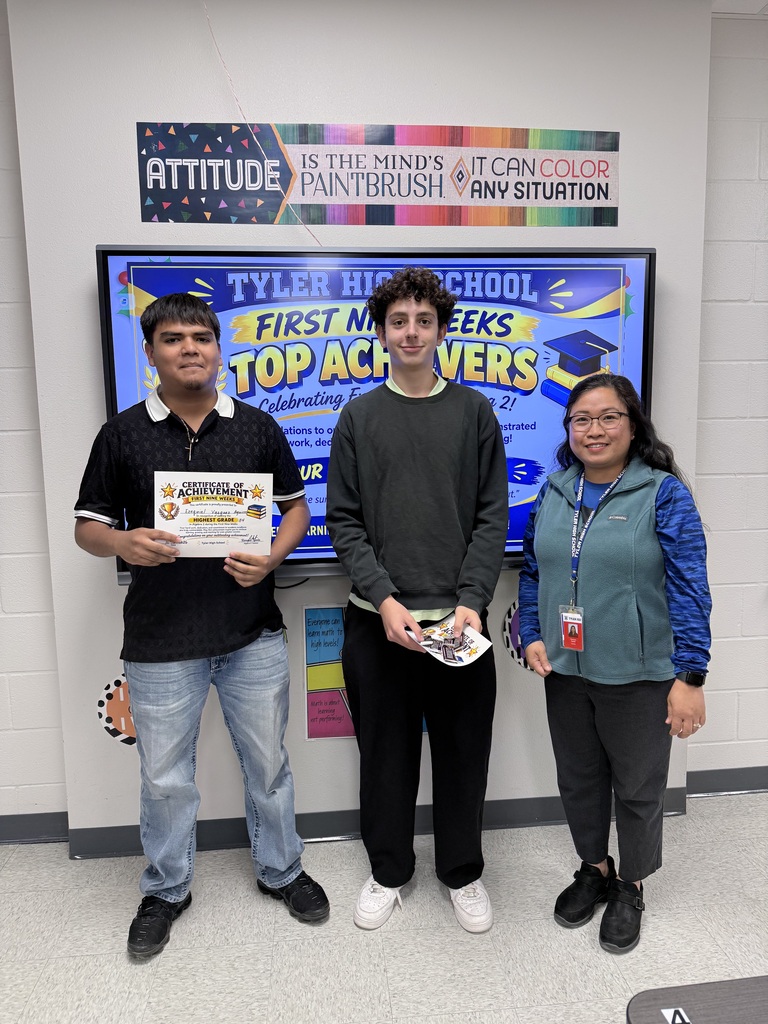 student and teacher with certificate