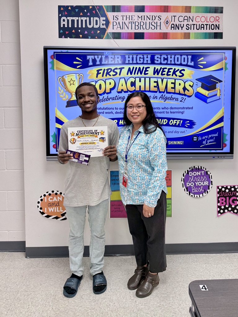 student and teacher with certificate