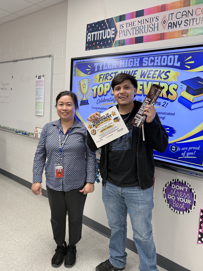 student and teacher with certificate