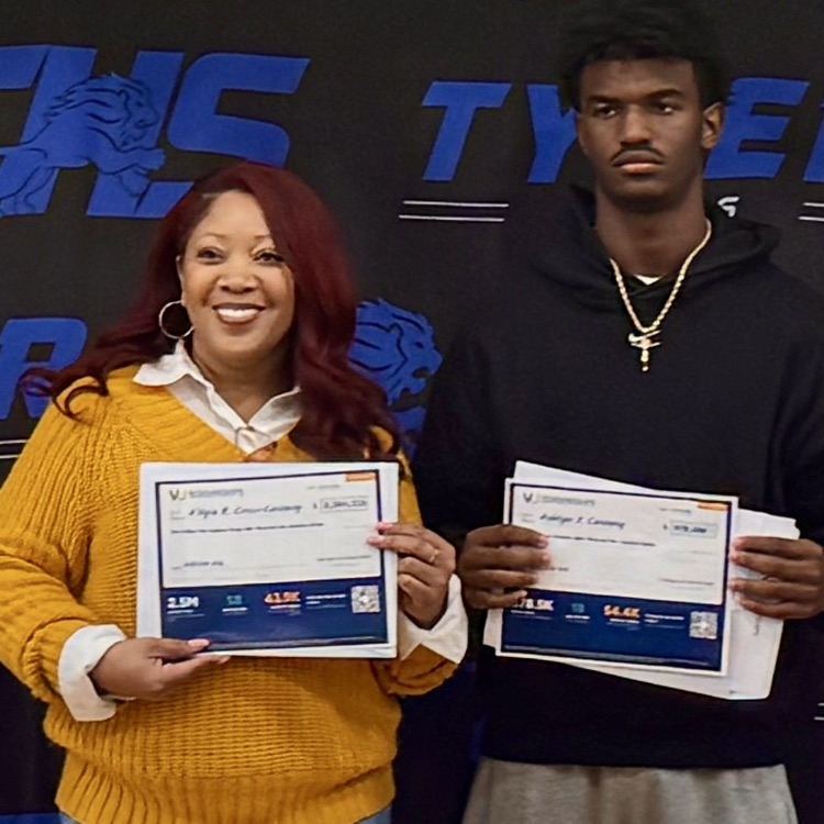student and teacher holding certificates