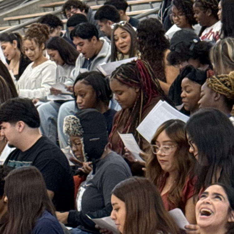 students reacting to opening award envelopes