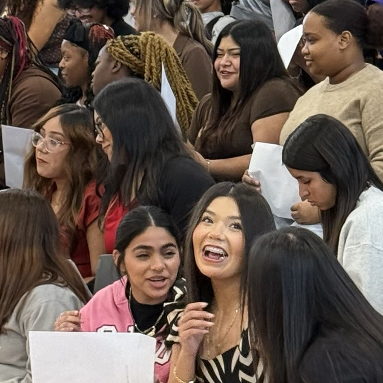 students reacting to opening award envelopes