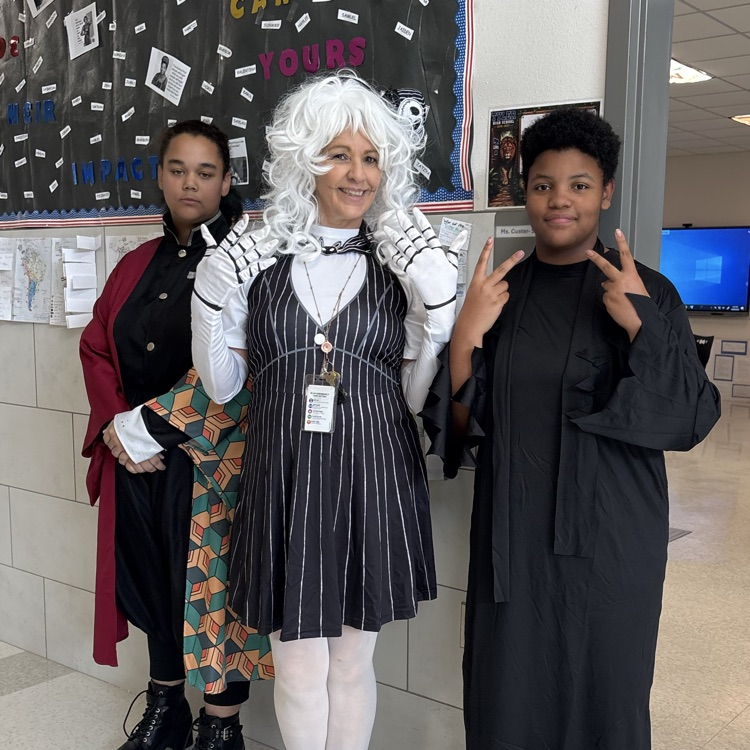 students and teacher in costume
