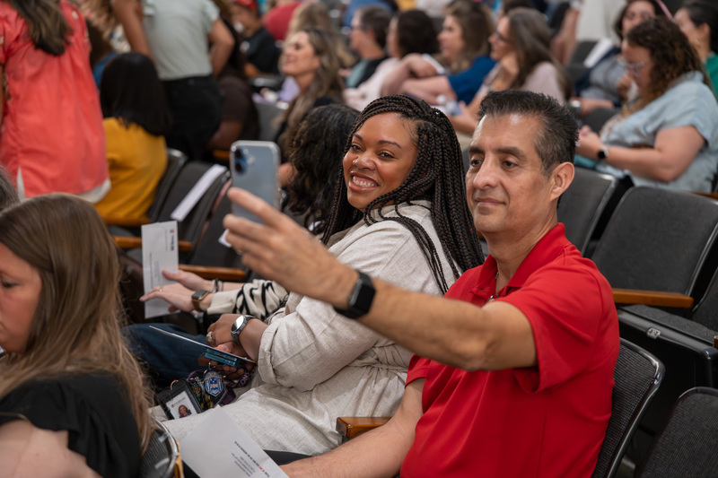 man and woman taking selfie