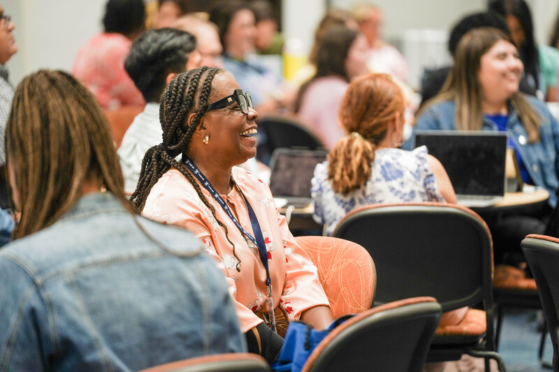 Educator smiles during math training