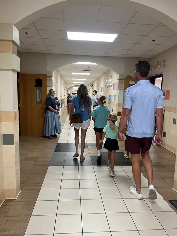 families walking to meet their new teacher