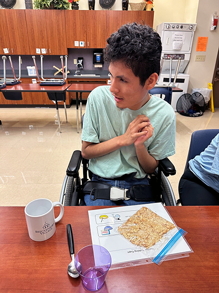 Students cooking in the home skills classroom
