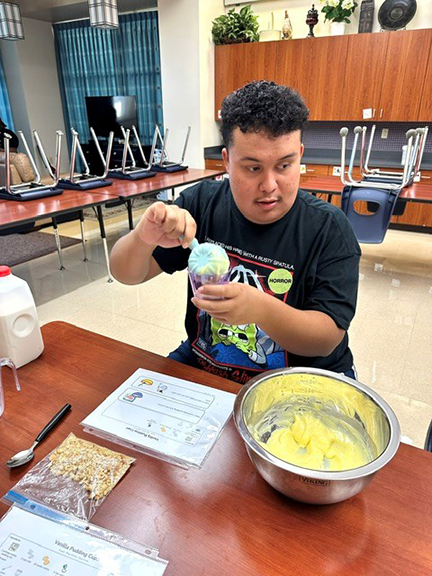 Students cooking in the home skills classroom