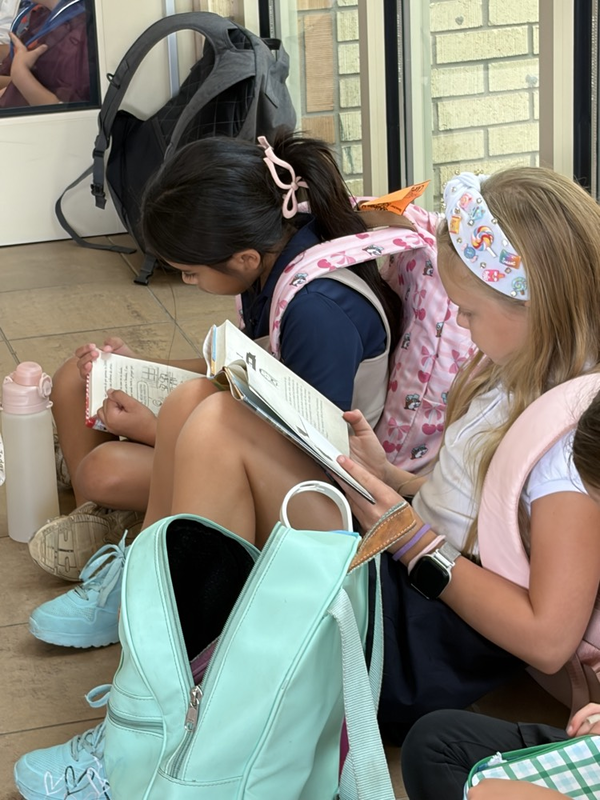 girls reading in dismissals