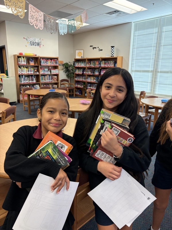two girls visiting the library